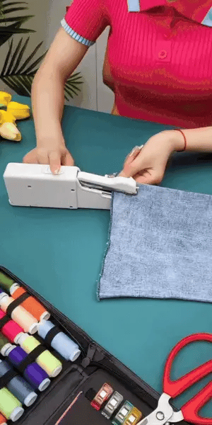Portable handheld sewing machine by Urbian Burj, compact mini sewing machine with a handle and sewing controls visible in the image.