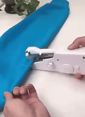 Portable handheld sewing machine by Urbian Burj, showing compact design and sewing needle for easy on-the-go mending.