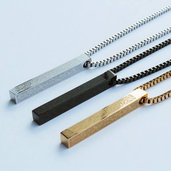 Urbian Burj Ayatul Kursi bar necklace with Arabic inscription on sleek silver chain, close-up of detailed pendant.