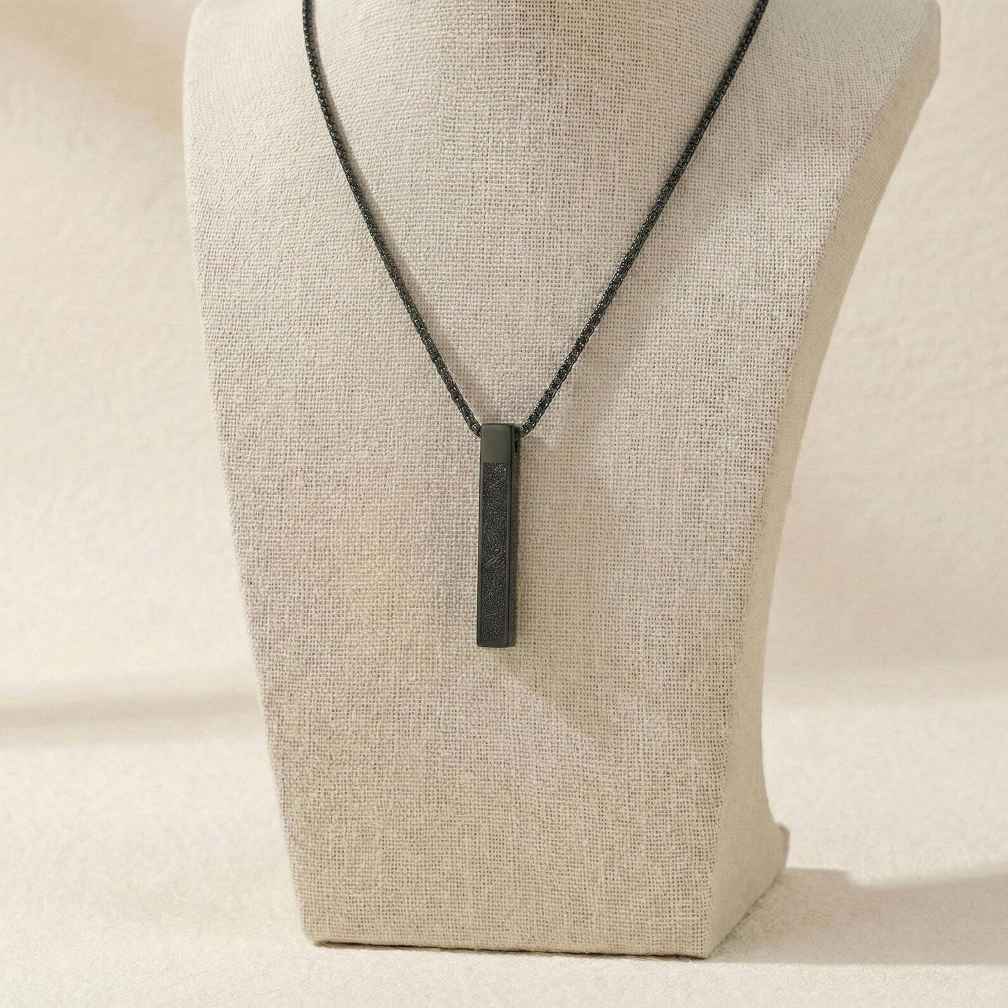 Urbian Burj Ayatul Kursi bar necklace featuring a sleek gold chain with engraved Quranic verse pendant.