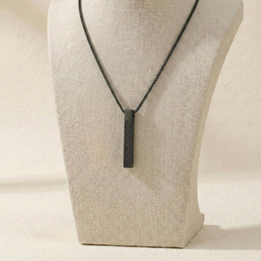 Urbian Burj Ayatul Kursi bar necklace featuring a sleek gold chain with engraved Quranic verse pendant.