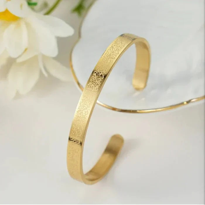 Islamic Ayat ul Kursi scripted bangle by Urbian Burj, gold-toned bracelet with engraved Quranic verse design.